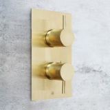 Close up product lifestyle image of the JTP Vos Brushed Brass Dual Outlet Shower Valve with Designer Knurled Handles